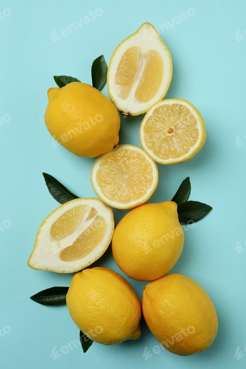 Preview: Ripe lemons on blue background, top view