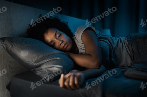 Preview: African american woman sleeping in her bed