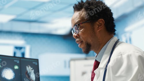 Preview: Male physician doing an x ray diagnostics scan interpretation during check up
