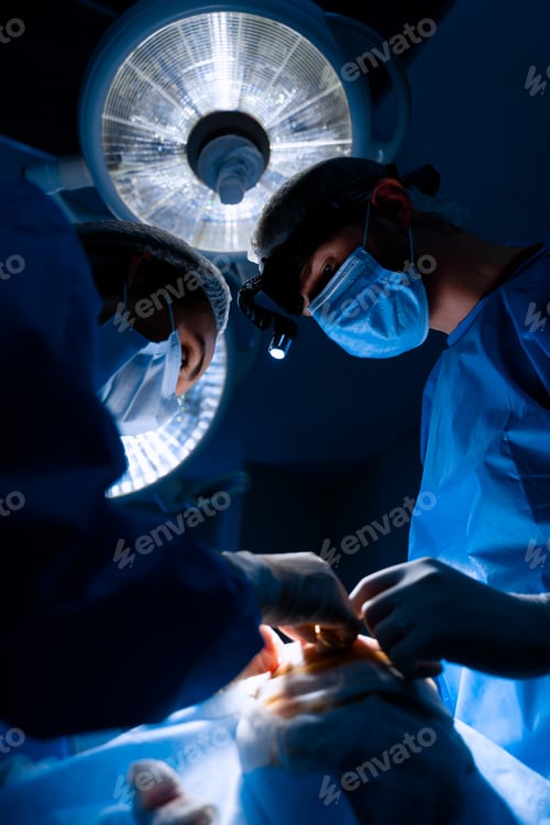 Preview: Surgeons Performing Operation in Hospital with Bright Lights