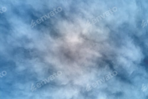 Preview: Aerial view from high altitude of earth covered with puffy rainy clouds forming before rainstorm
