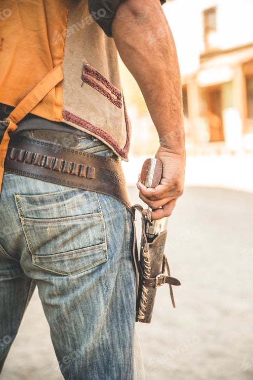Preview: Cropped close up of cowboy holster and gun on wild west film set, Fort Bravo, Tabernas, Almeria,