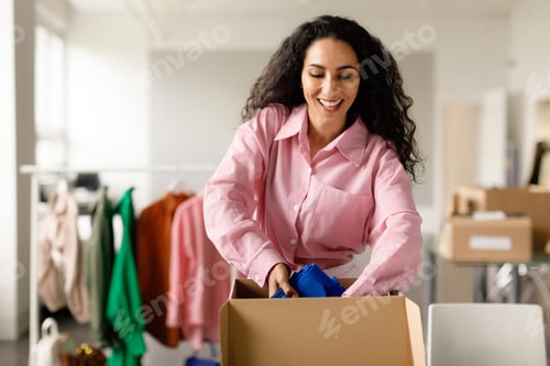 Preview: Lady Packing Garment In Box Working In Online Clothing Store