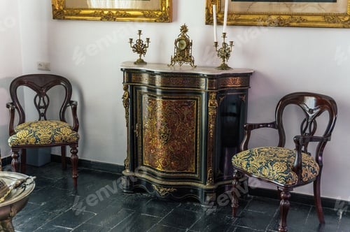 Preview: Antique chairs near cabinet with decorations