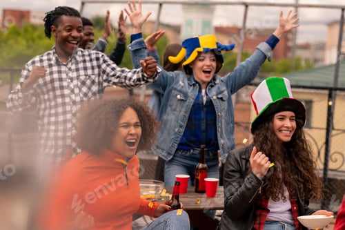 Preview: Three happy girls and guy cheering for their team during broadcast outdoors