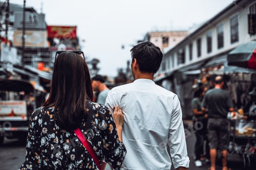 Preview: Back view of young couple enjoy walking at Khaosan Road, Bangkok
