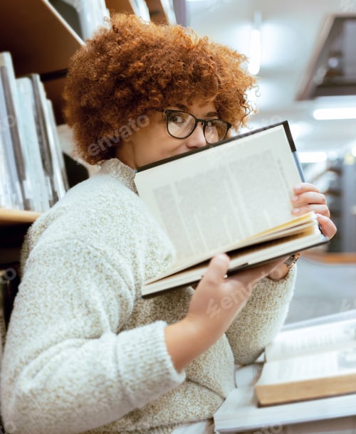 Preview: Books, education or black woman in a library reading for knowledge or development for future growth