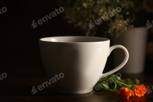 Preview: Tea In A White Cup Is On The Table At Night