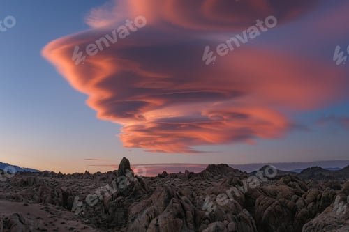 Preview: Looking up into the sky at sunset with a vibrant lenticular cloud overhead in the Alabama Hills