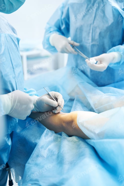 Preview: Surgeons Operating on Patient in Bright Operating Room