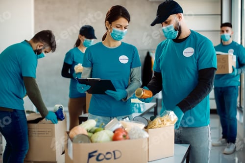 Team Sorting Food Donations Wearing Face Masks