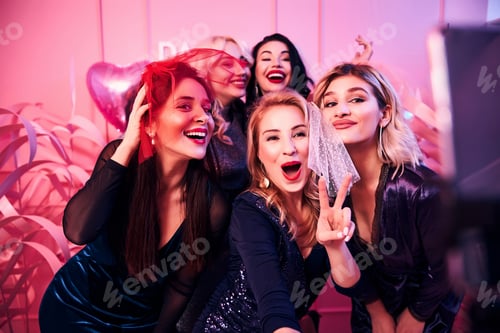 Preview: Cheerful ladies taking selfies at the bachelorette party