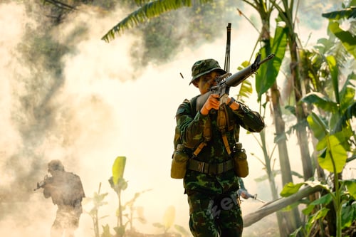 Preview: Bullet shell go out from gun after soldier shooting near banana tree and fog as background.