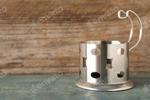Preview: Traditional tea glass holder on wooden table, space for text
