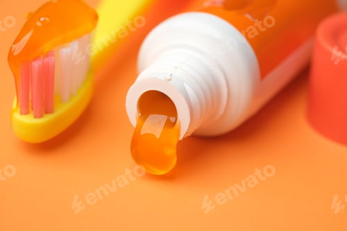 Preview: orange color child tooth brush with paste