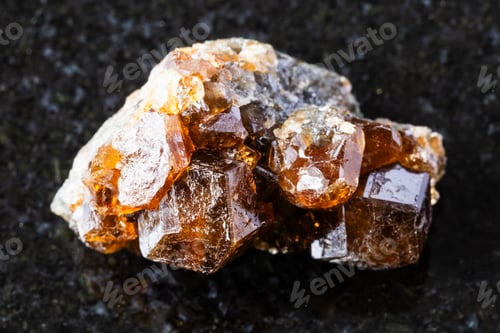 Preview: sample of raw hessonite grossular mineral on black