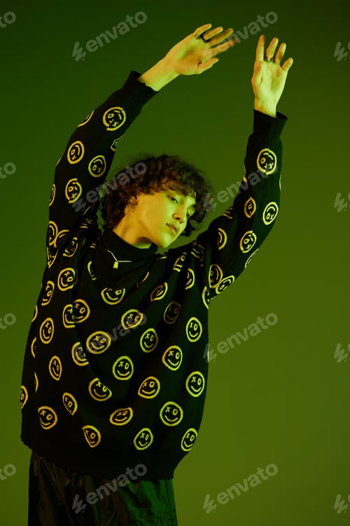 Preview: Man fashion and style accessories model with curly hair stylish sweater, hipster dance smile hands