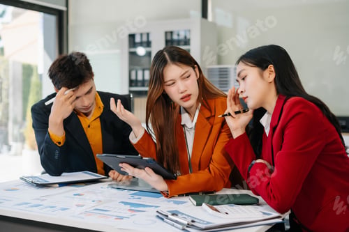 Preview: Businessman team working are under stress from financial data and report graph.
