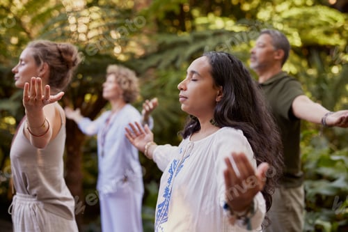 Preview: Adults Performing Yoga in Tranquil Green Garden