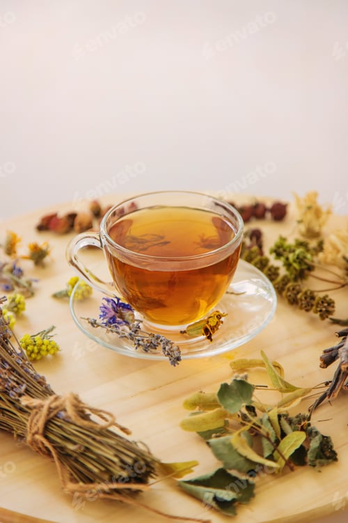 Preview: Herbal tea with medicinal herbs and flowers. Selective focus.