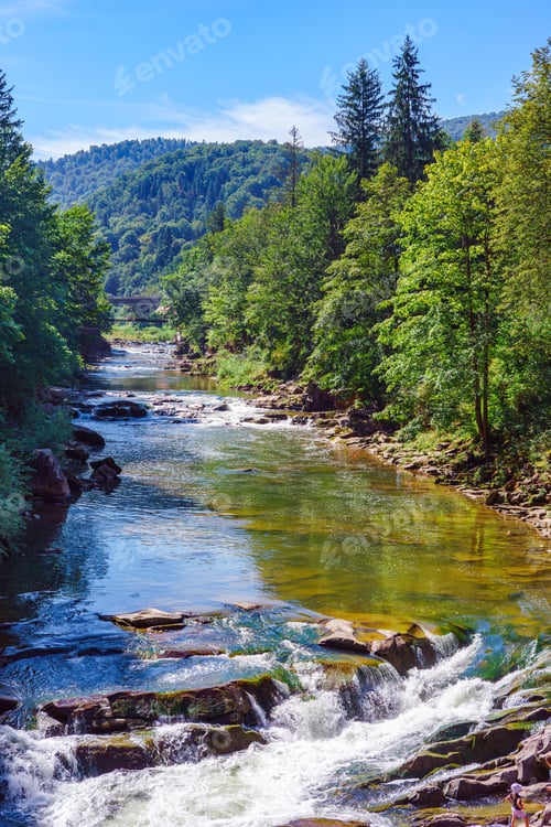 Preview: Mountain Fast River With Waterfall And Lush Forest In Carpathians On Sunny Summer Day In Ukraine