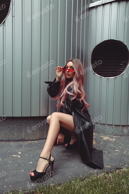 Preview: Woman in Black Coat and Red Sunglasses Squatting