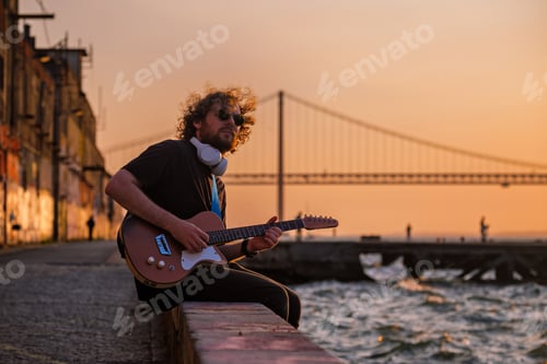 Preview: Street musician playing electric guitar in the street