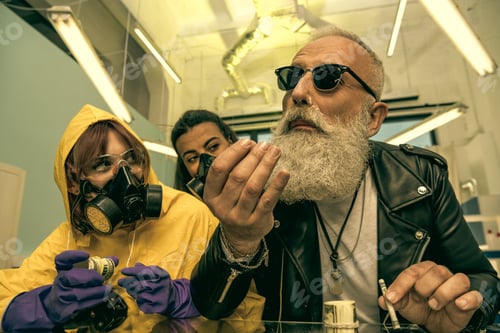 Preview: grey hair man with beard taking drugs with women in personal protective equipment, drugs concept
