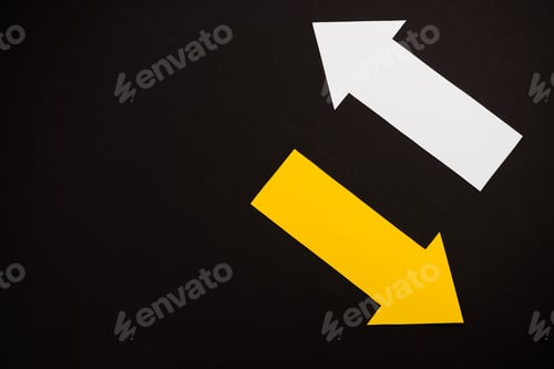 Preview: top view of directional white and yellow arrows isolated on black