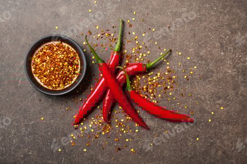 Preview: Red chili pepper on stone background