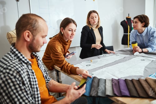 Preview: Team of designers choosing suitable color of fabric