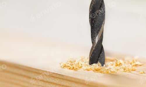 Preview: Metal drill bit make holes in a wooden plank