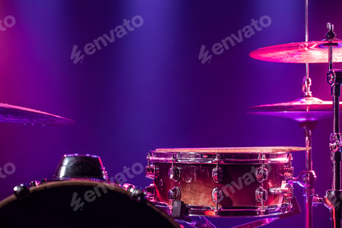 Preview: Drums and drum set. Beautiful blue and red background, with rays of light.