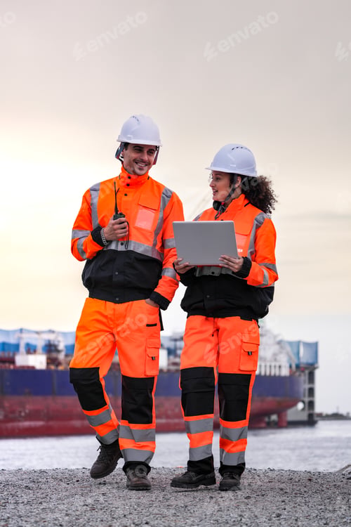 Preview: Two port engineers communicate while inspecting dockside logistics