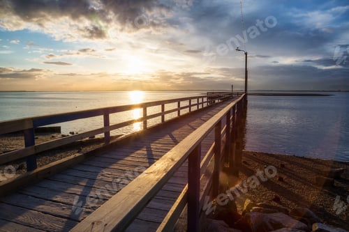 Preview: Sunset at the beach by the wooden quay