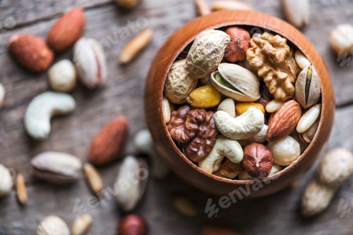 Preview: Mixed nuts in wooden bowl