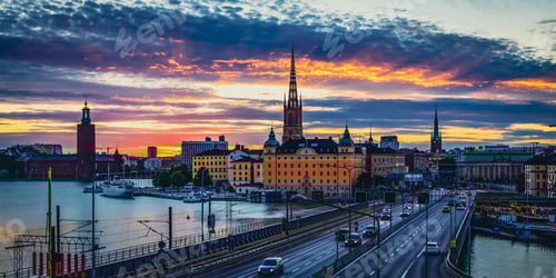 Preview: Beautiful high angle shot of cars driving on bridges over a lake in the sunset in Stockholm.