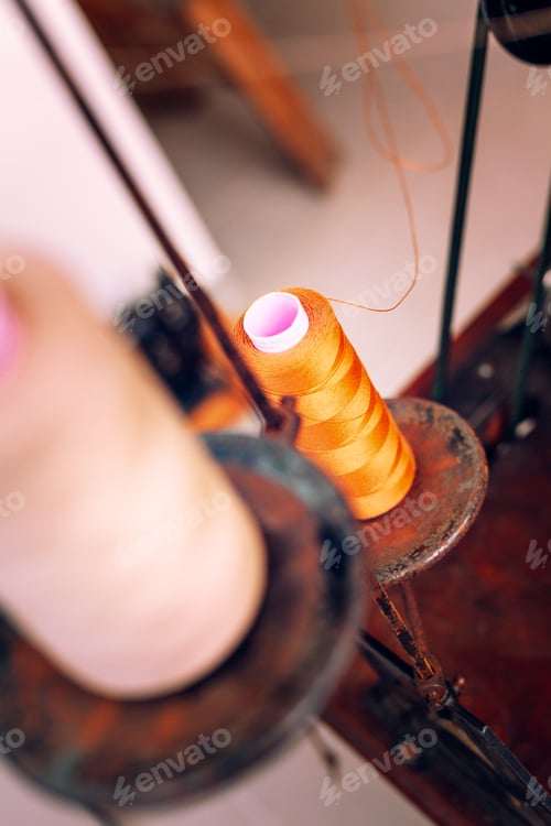 Preview: Vintage sewing machine with vibrant thread spools