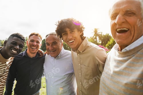 Preview: Multi generational men smiling in front of camera - Male multiracial group having fun togheter