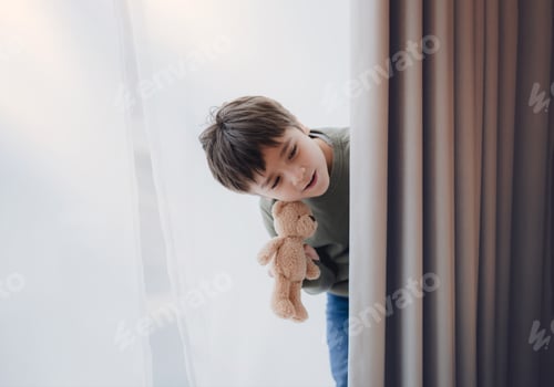 Preview: Young Boy Peeking Around Curtain Holding Teddy Bear