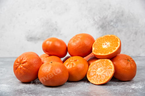 Preview: Juicy orange fruits with slices on stone background