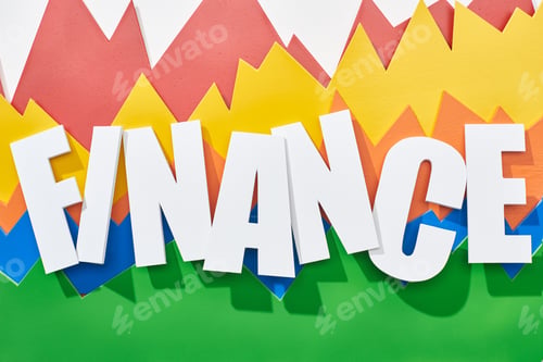 Preview: top view of finance inscription on white background with color statistic graphs