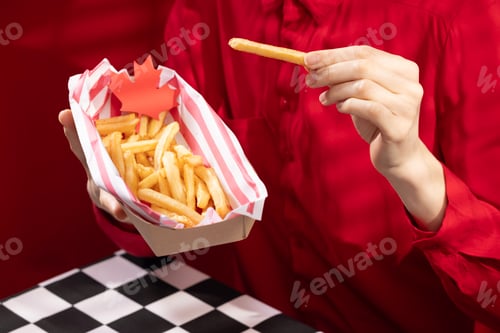 Preview: Canada Day traditional food concept. A girl in a classy cafe eats in Canada. Breakfast and lunch.