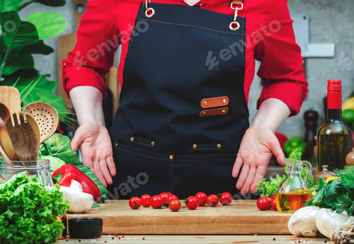 Preview: Chef pours out cherry tomatoes on cutting board. Cozy kitchen with wooden table