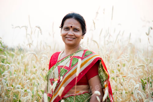 Preview: Smiling woman farmer in agricultural field