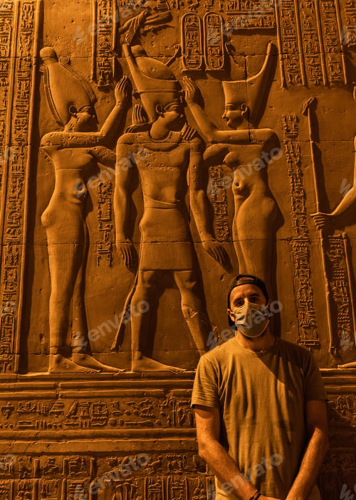 Vista previa: A Young Man With A Face Mask Visiting At Night The Beautiful Temple Of Kom Ombo, The Temple