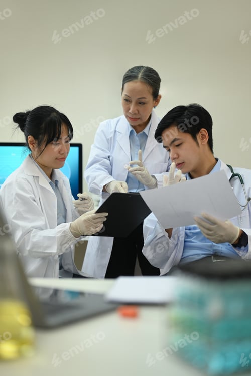Preview: Team of professional scientists analyzing test samples, discussing about new test results.