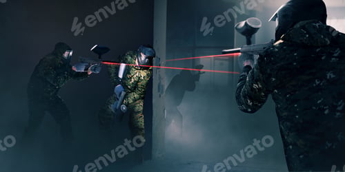 Preview: Paintball team in battle, guns with a laser sight