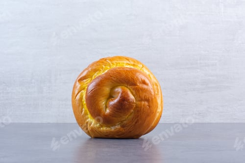 Preview: Sweet bun standing upright on marble background