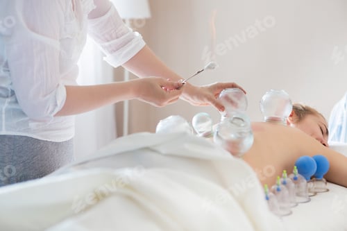 Preview: Young woman getting treatment at medical clinic
